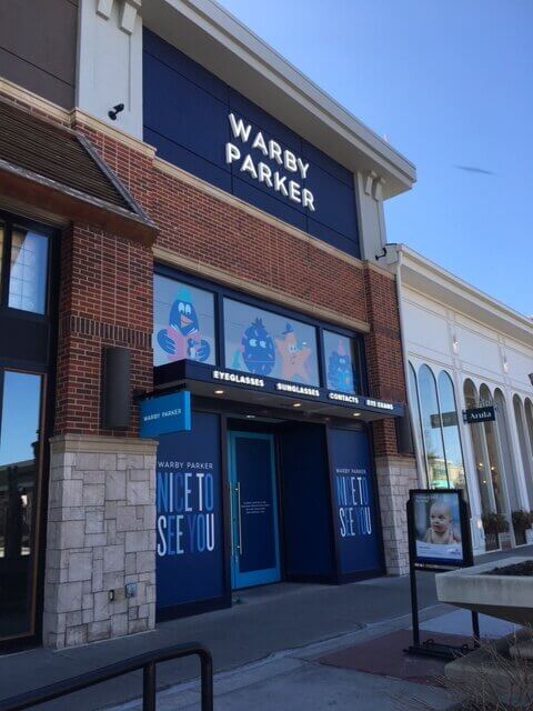 Warby Parker sign installed on building