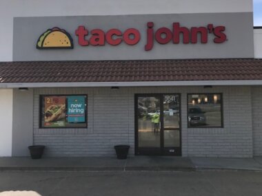 Taco John's sign installed on building