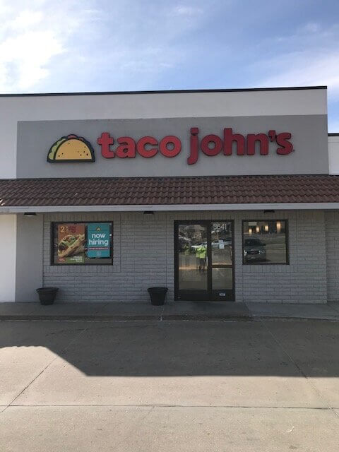 Taco John's sign installed on building