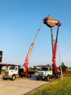 Harley Davidson sign installation with truck