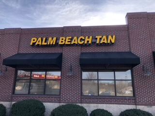 Palm Beach Tan Sign Installation