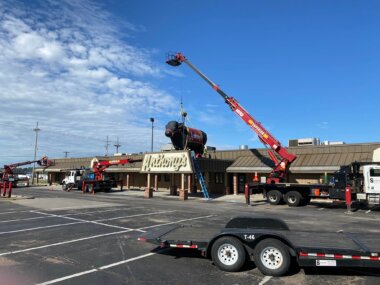 Anthony's sign with bull being installed